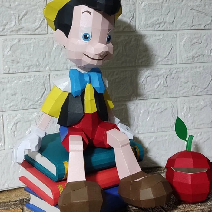 Boy Pinocchio Sitting on The Book and Apple/ Pinocho/ DiY Craft/ Template PDF/ Low Poly/ Papercraft/ 3D Boy Doll/ Origami/ Home decor